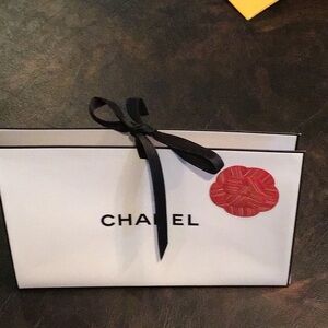CHANEL White Shopping Bag with Black Ribbon and Red Camellia Accent